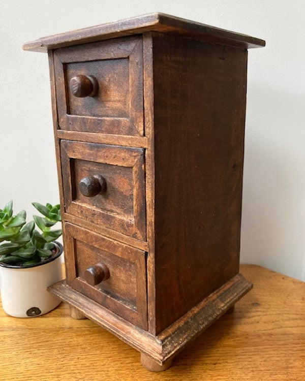 Image of Miniature chest of drawers profile view