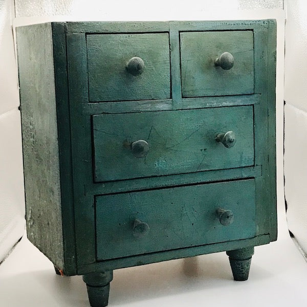 Image of Small green cabinet angled view