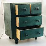 Image of Small green cabinet drawers out
