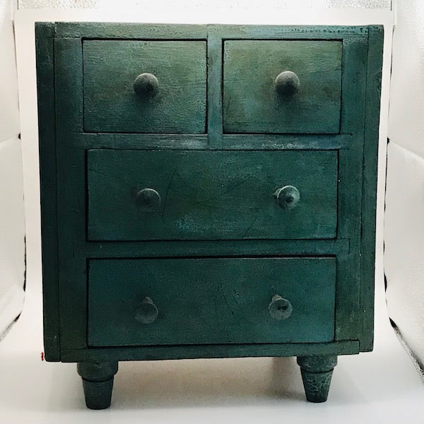 Image of Small green cabinet front view