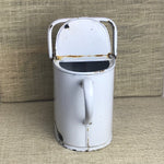 Image of White lidded enamel watering can facing back