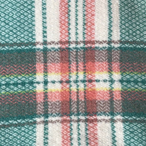 Image of close up of green and pink welsh blanket